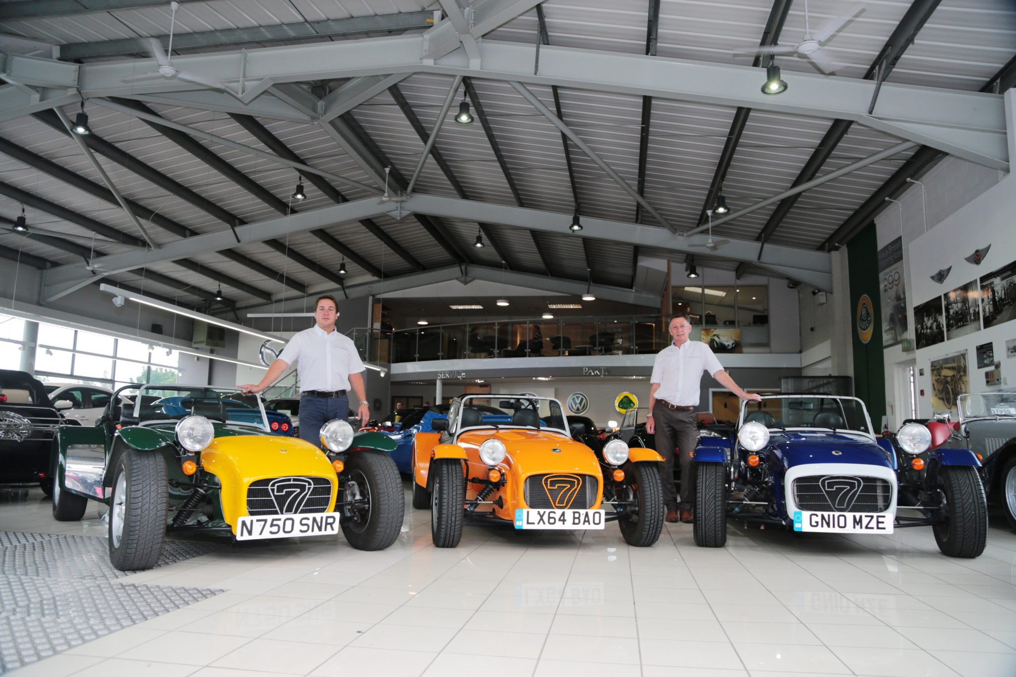 Oakmere Motor Group Jonathan Jarratt (l) with three of his Caterham Sevens and Sales Manager Steve Jeavons